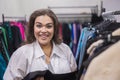 Smiling fat woman in plus size store looking at camera. Royalty Free Stock Photo