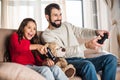 smiling father and daughter playing video game Royalty Free Stock Photo