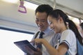 Smiling Father and daughter watching a movie in the subway on digital tablet Royalty Free Stock Photo