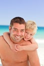 Smiling father having son a piggyback Royalty Free Stock Photo