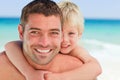 Smiling father having son a piggyback Royalty Free Stock Photo