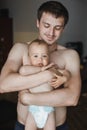 Smiling father with a one-year-old son in his arms Royalty Free Stock Photo
