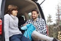 Smiling father and son taking a short break during spring hiking Royalty Free Stock Photo