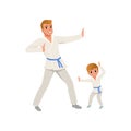 Smiling father and son training karate blows. Dad and child wearing kimonos and blue belts. Martial art. Fatherhood