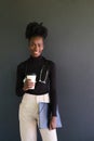 Smiling female african medical student with stethoscope, folders and a coffee. Royalty Free Stock Photo