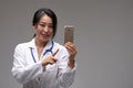 Smiling female Asian doctor or nurse