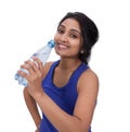 Smiling female athelte with water bottle