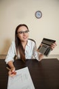 Smiling female bookkeeper has reduced balance