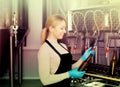 Smiling female brewery worker with bottling machinery Royalty Free Stock Photo