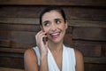 Smiling female business executive talking on mobile phone Royalty Free Stock Photo