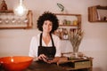 Smiling female cafe owner standing looking at camera Royalty Free Stock Photo