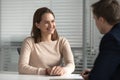 Smiling female candidate make good first impression at interview