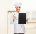 Smiling female chef with black blank paper Royalty Free Stock Photo