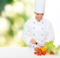 Smiling female chef chopping vegetables Royalty Free Stock Photo