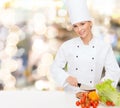 Smiling female chef chopping vegetables Royalty Free Stock Photo