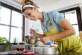 Female chef mixing ingredients of cake in bowl