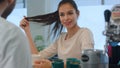 Smiling female client flirting with bartender at bar counter in cafe