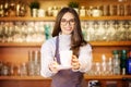 Smiling female coffee shop owner businesswoman standing behind the counter in the cafe Royalty Free Stock Photo