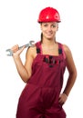 Smiling female construction worker holding wrench Royalty Free Stock Photo