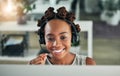 Smiling female customer service representative using headset and consulting clients online. Call center concept. African Royalty Free Stock Photo