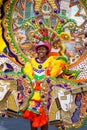 Smiling, female dancing troope leader in brightly colored costume, performs in Junkanoo, in Nassau.