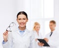 Smiling female doctor with eyeglasses Royalty Free Stock Photo