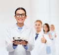 Smiling female doctor with eyeglasses Royalty Free Stock Photo