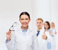 Smiling female doctor with eyeglasses Royalty Free Stock Photo