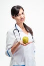 Smiling female doctor holding apple Royalty Free Stock Photo