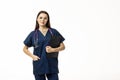 Smiling female doctor in lab coat with arms crossed looking away and posing against grey background. Medicine concept Royalty Free Stock Photo