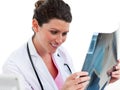 Smiling female doctor looking at X-ray Royalty Free Stock Photo