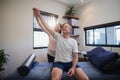 Smiling female doctor and male patient looking up with arms raised Royalty Free Stock Photo