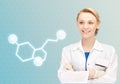 Smiling female doctor with molecule of serotonin