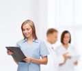 Smiling female doctor or nurse with clipboard Royalty Free Stock Photo