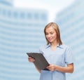 Smiling female doctor or nurse with clipboard Royalty Free Stock Photo