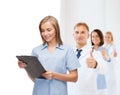 Smiling female doctor or nurse with clipboard Royalty Free Stock Photo