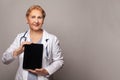 Smiling female doctor or nurse showing tablet pc computer Royalty Free Stock Photo