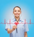 Smiling female doctor or nurse with stethoscope Royalty Free Stock Photo