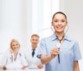 Smiling female doctor or nurse with stethoscope Royalty Free Stock Photo