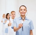 Smiling female doctor or nurse with stethoscope Royalty Free Stock Photo