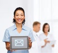 Smiling female doctor or nurse with tablet pc