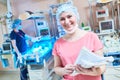 Smiling female doctor portrait in front of intensive care unit for newborn baby Royalty Free Stock Photo