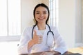 Smiling female doctor recommend good hospital service