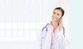 smiling female Doctor talks to the cell phone, concept of medical worker
