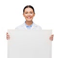 Smiling female doctor with white blank board Royalty Free Stock Photo