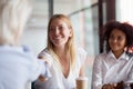 Smiling female employee handshake colleague at company meeting Royalty Free Stock Photo