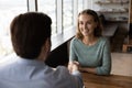 Smiling female employee handshake business partner at meeting Royalty Free Stock Photo