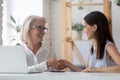 Smiling female employees handshake getting acquainted in office Royalty Free Stock Photo