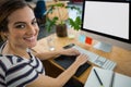 Smiling female graphic designer working on computer Royalty Free Stock Photo