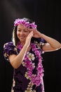 Smiling female Hawaiian girl dancing and singing with musical instruments like the ukulele Royalty Free Stock Photo